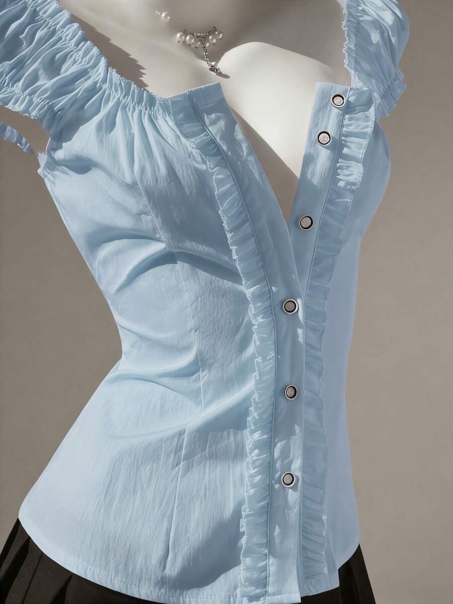 Women's black off-shoulder cap sleeve blouse with ruffled detailing and a tie-back design.