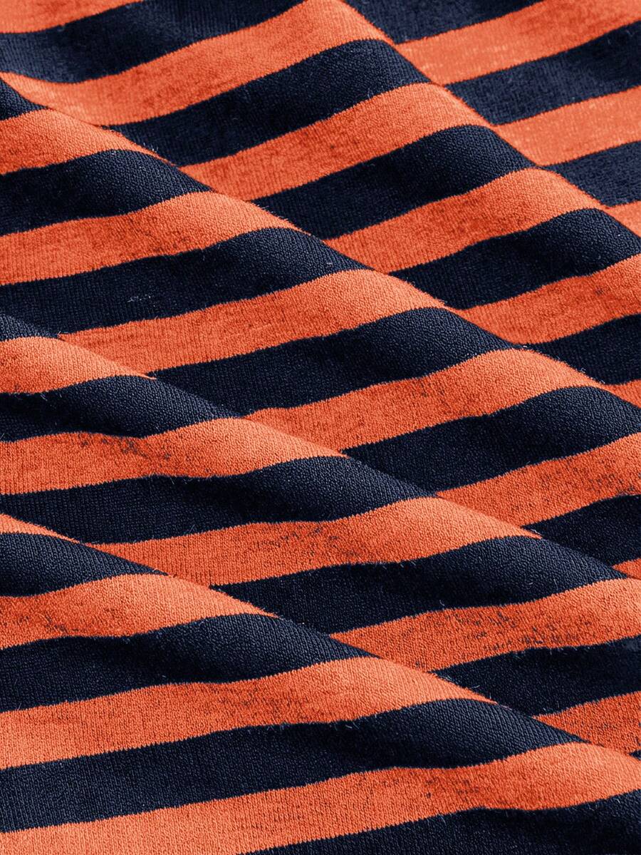 Women's striped strapless tube top featuring ruched detailing, flared hem, and stretchy knit fabric.