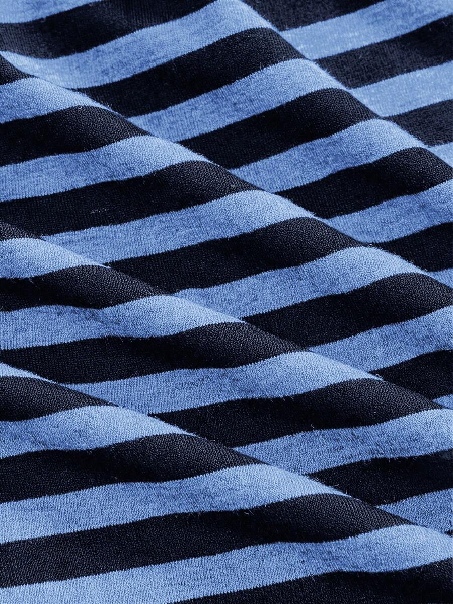 Women's striped strapless tube top featuring ruched detailing, flared hem, and stretchy knit fabric.