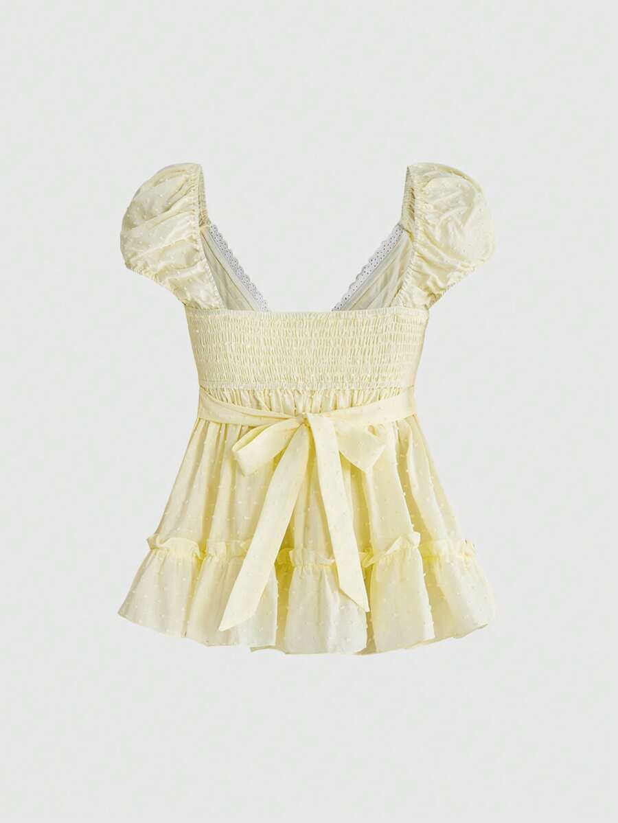 Women's deep V-neck cotton peplum blouse featuring short puff sleeves, delicate frill trim, and a flared hem.