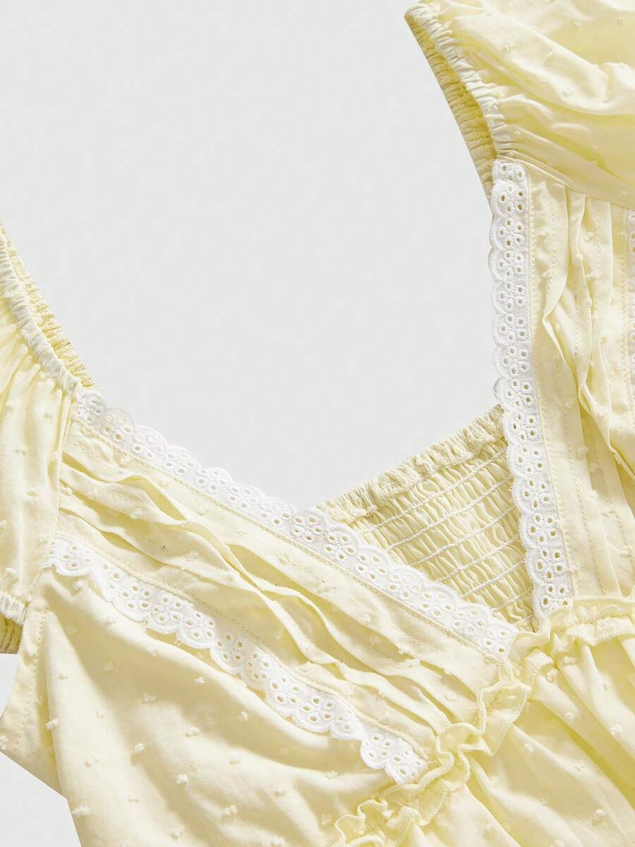 Women's deep V-neck cotton peplum blouse featuring short puff sleeves, delicate frill trim, and a flared hem.