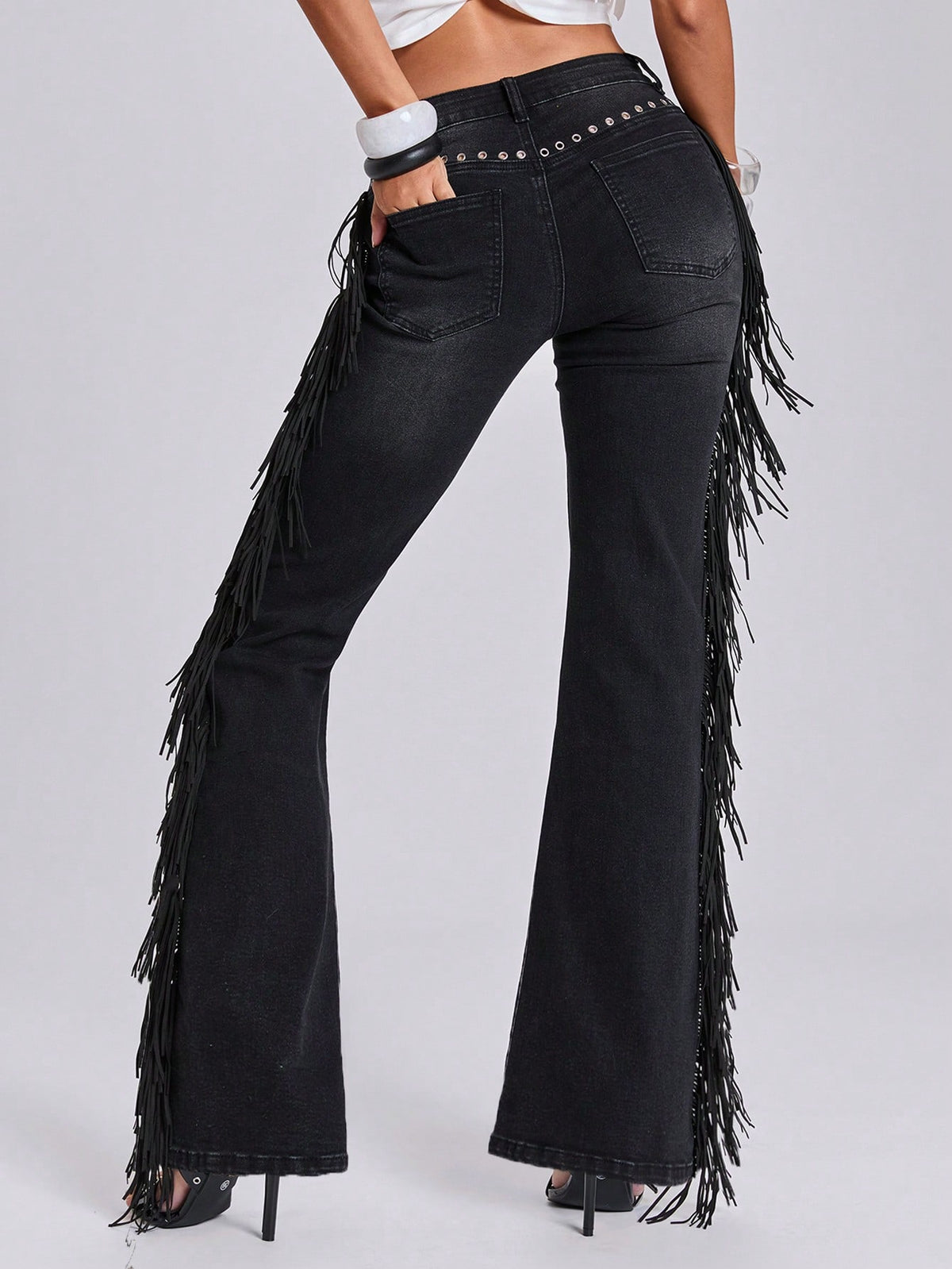 Women's ultra low waist flare jeans in washed stretch denim featuring an extra long bootcut leg and zipper fly closure.