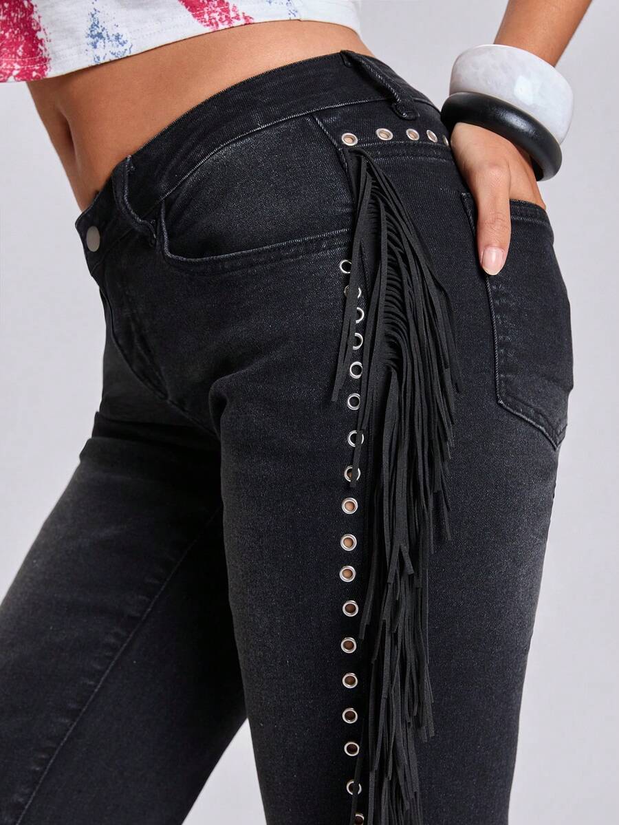 Women's ultra low waist flare jeans in washed stretch denim featuring an extra long bootcut leg and zipper fly closure.