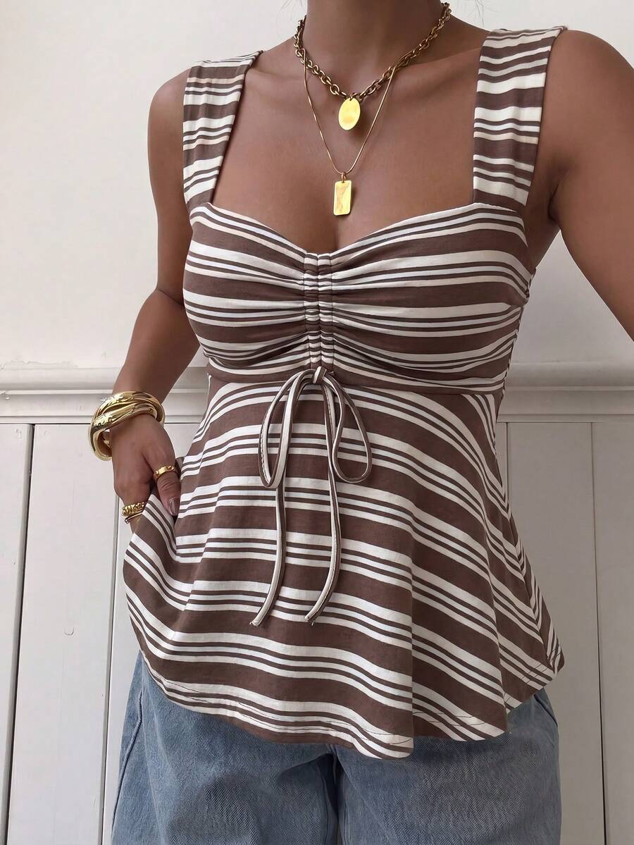 Women's striped camisole tank top with strap neckline, backless knot detail, cold shoulder styling, slim fit, and flared hem for casual vacation or daily wear.