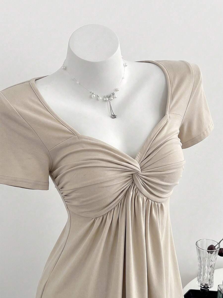Women's short sleeve V-neck T-shirt featuring a front twist knot detail and slim fit.