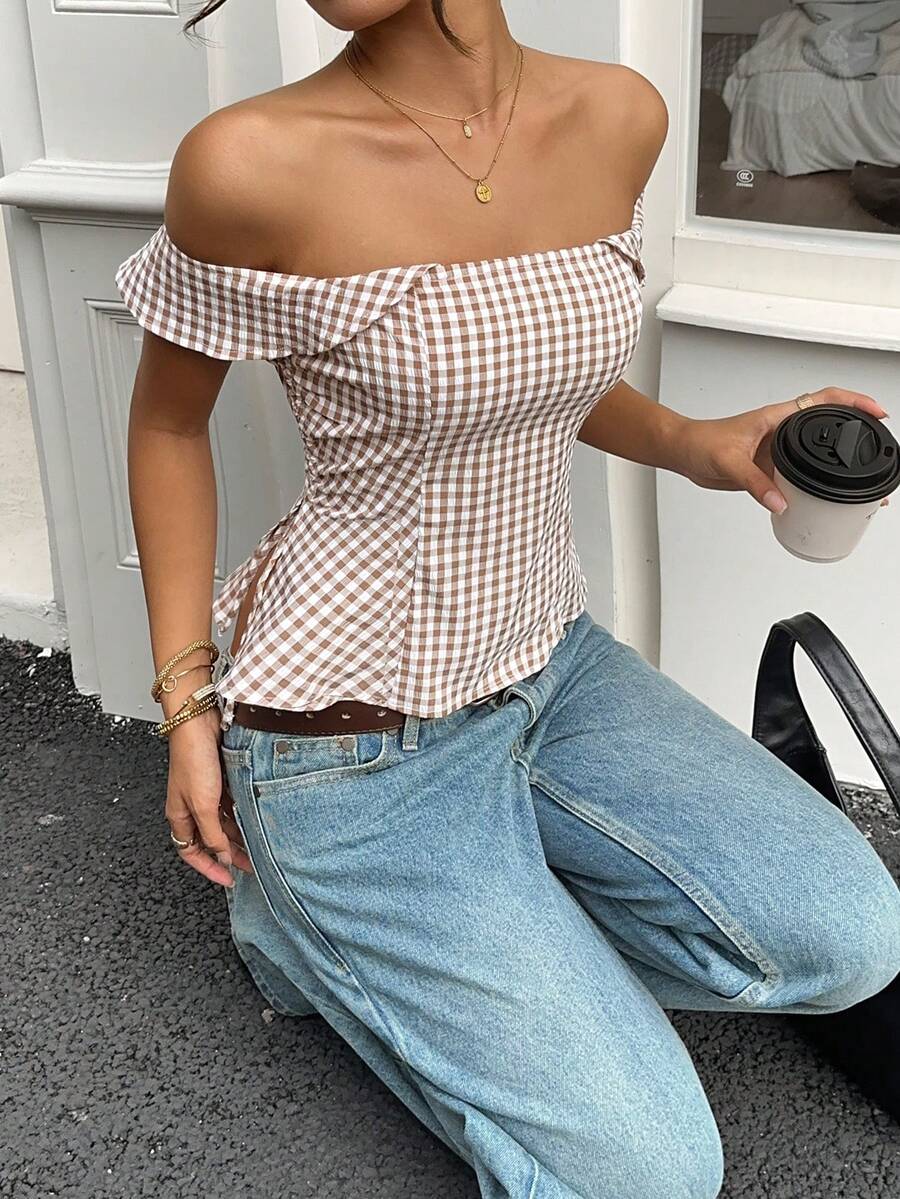 Brown gingham off-the-shoulder crop top for women featuring a slim fit, ruched design, cap sleeves, and knot detail.