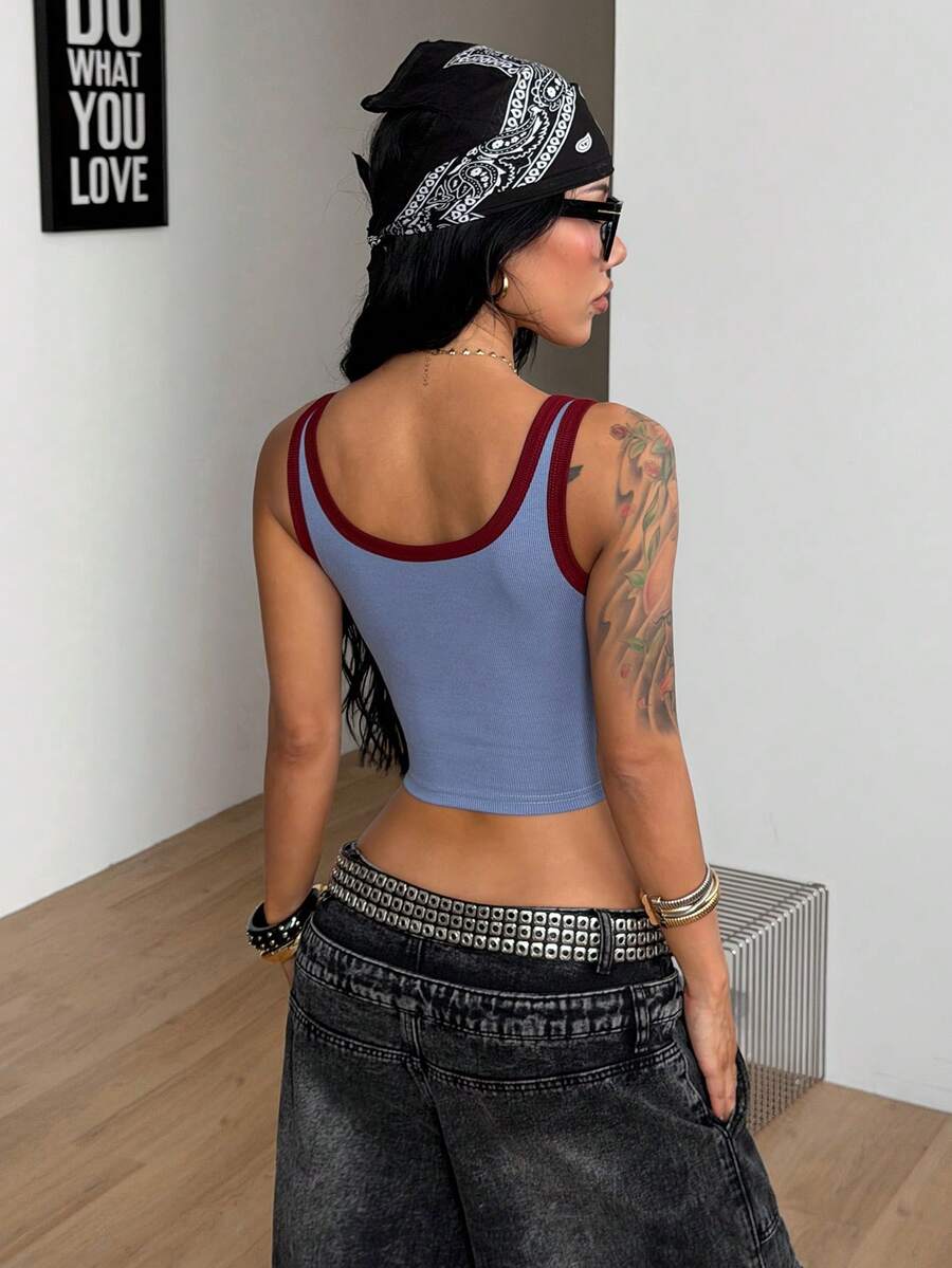 Women's striped rib-knit crop tank top with a notched neckline and slim fit.