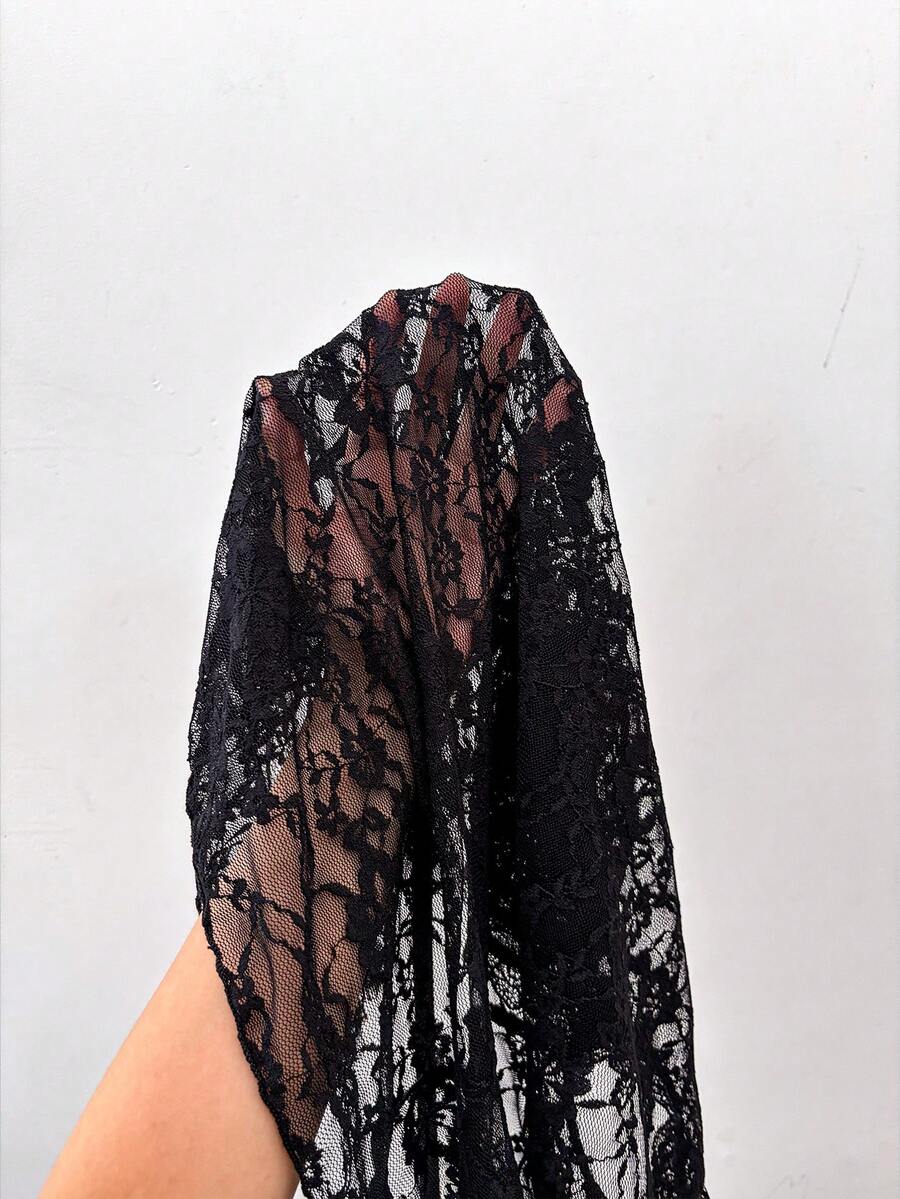 Women's semi-sheer deep V-neck top featuring cap sleeves, contrast lace trimming, and a lace-up front detail.