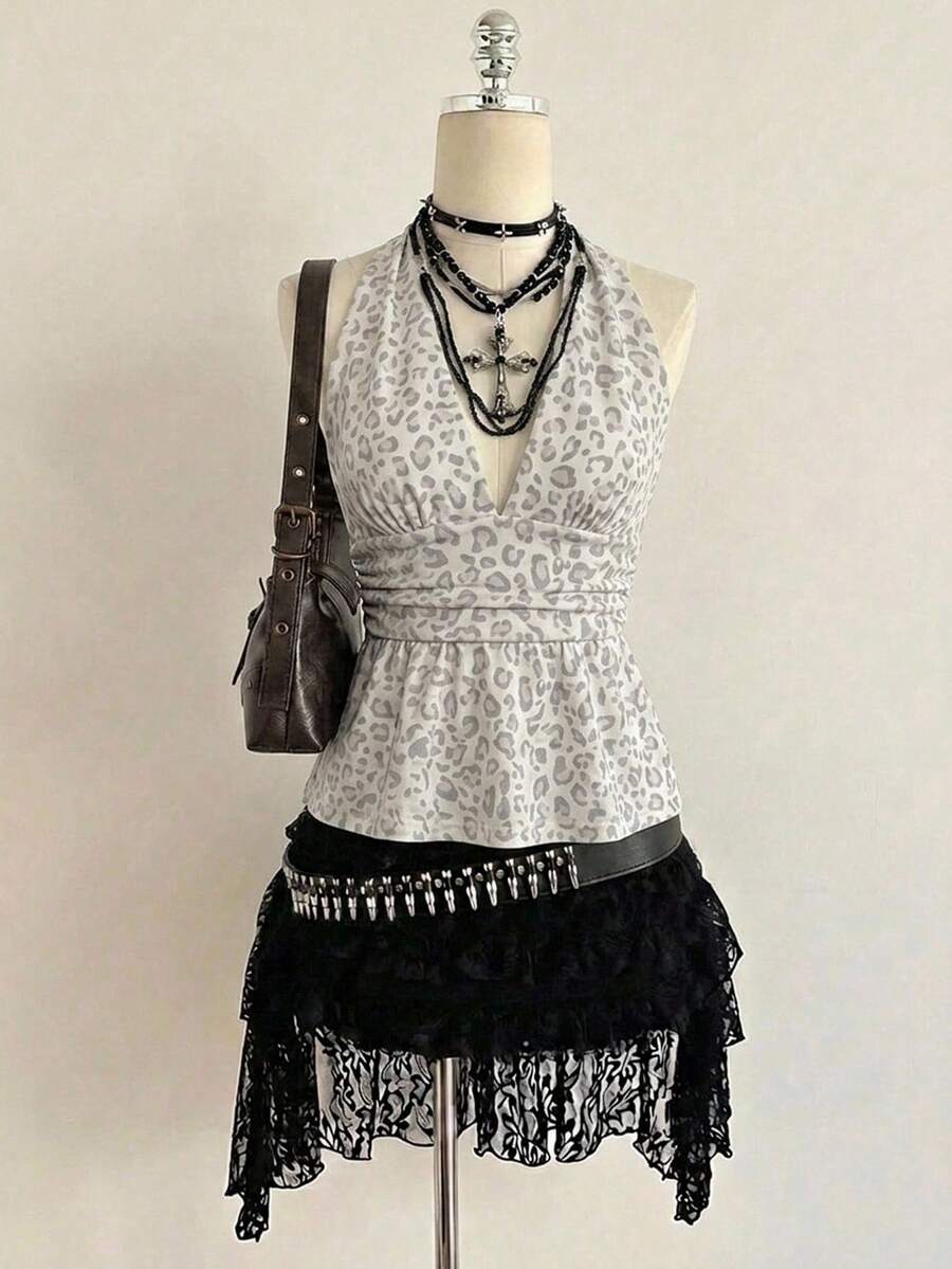 Women's backless halter babydoll tank top featuring a square neckline, slim fit silhouette, and a flared ruffle hem.