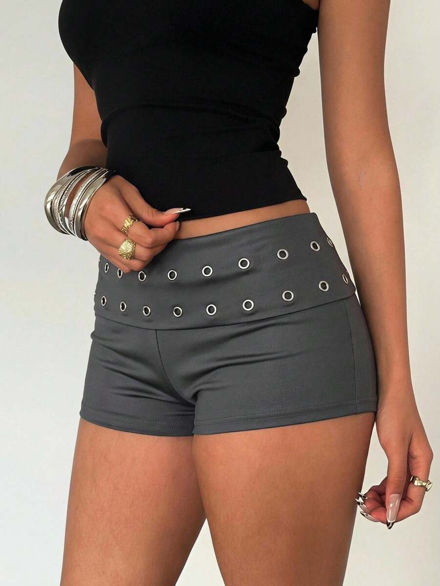 Women's studded PU ultra low waist mini shorts with zipper fly closure, skinny fit, mini length, and plain unlined design.