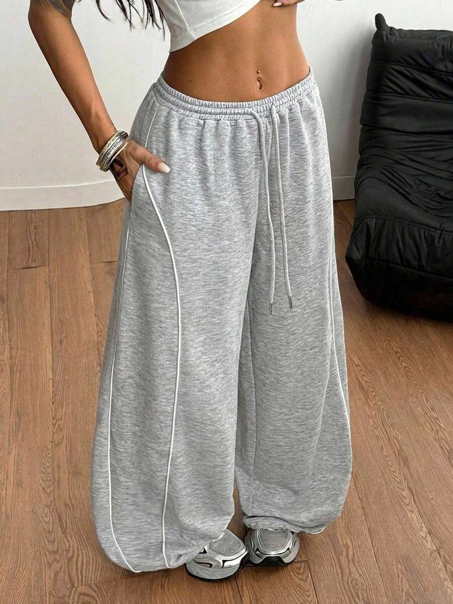 Women's wide leg trousers with a tree branch graphic pattern, loose fit, and mid-rise waist in woven fabric.