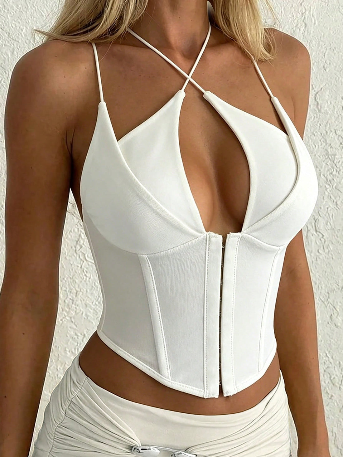 Yueweini white women's corset camisole top featuring a front zipper, criss-cross hollow design, backless cut, and slim crop fit.