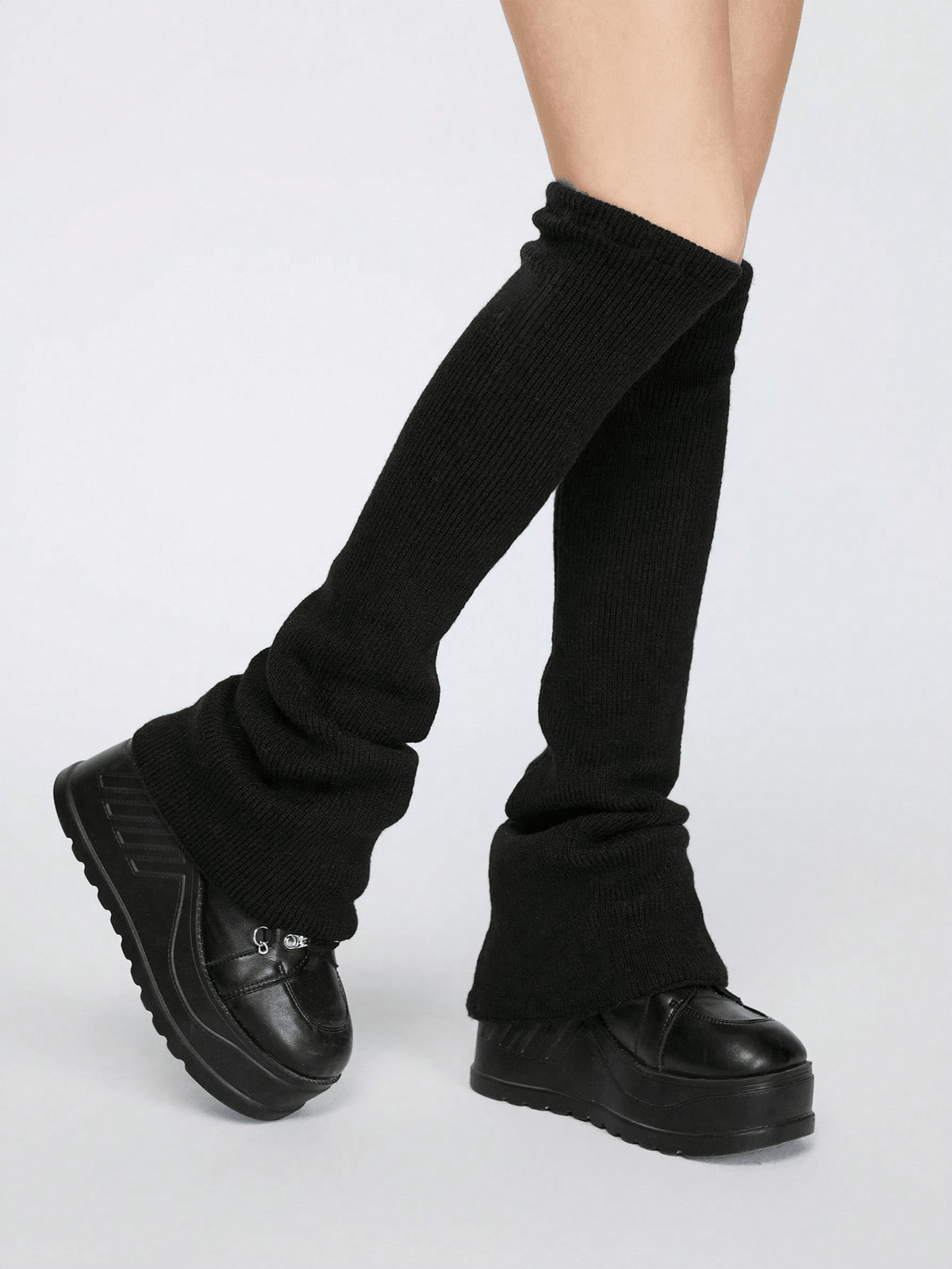 Pair of women's extra long knitted leg warmers featuring a gothic grunge design with subtle ruffle detailing.