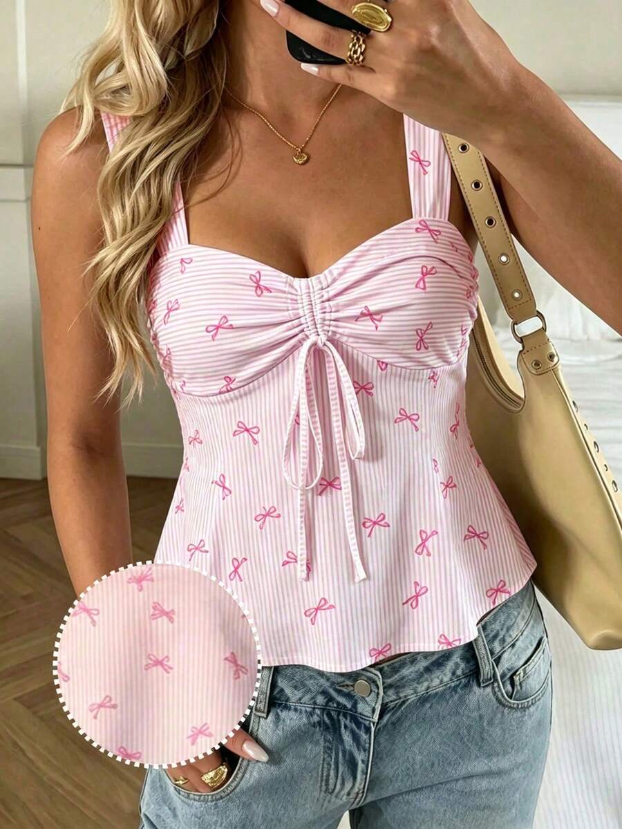 Women's striped camisole tank top with strap neckline, backless knot detail, cold shoulder styling, slim fit, and flared hem for casual vacation or daily wear.