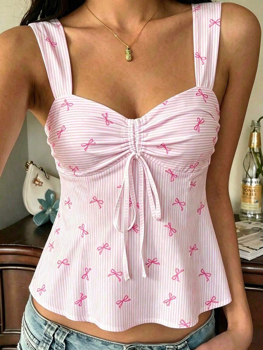 Women's striped camisole tank top with strap neckline, backless knot detail, cold shoulder styling, slim fit, and flared hem for casual vacation or daily wear.