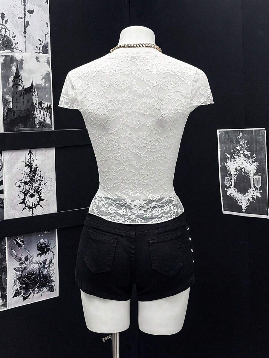 Women's semi-sheer deep V-neck top featuring cap sleeves, contrast lace trimming, and a lace-up front detail.