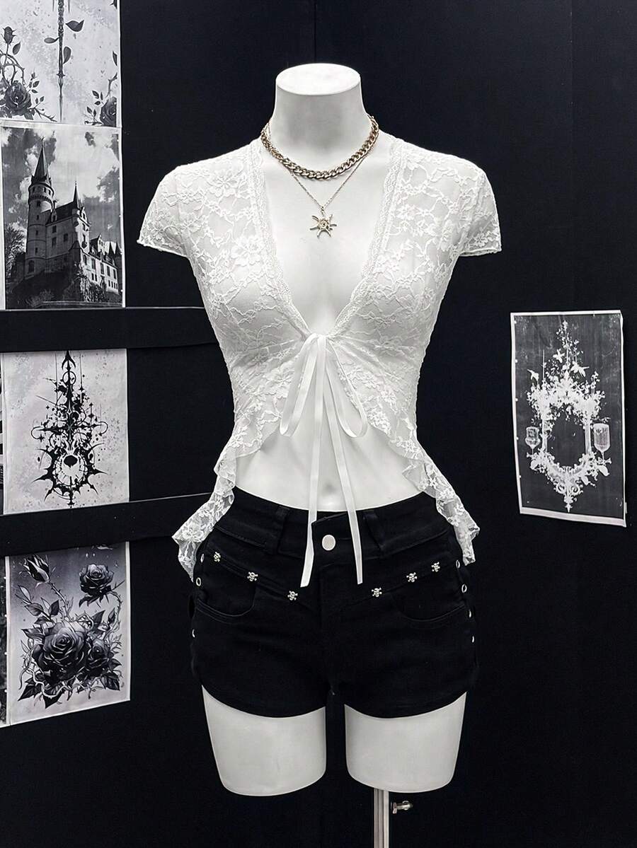 Women's semi-sheer deep V-neck top featuring cap sleeves, contrast lace trimming, and a lace-up front detail.