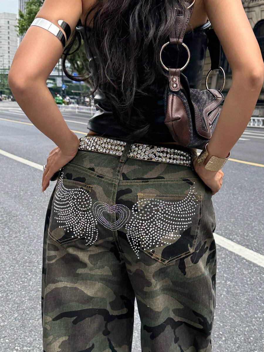 Front view of women's loose wide leg denim jeans featuring a mid waist, classic front pockets, and a zipper fly closure.