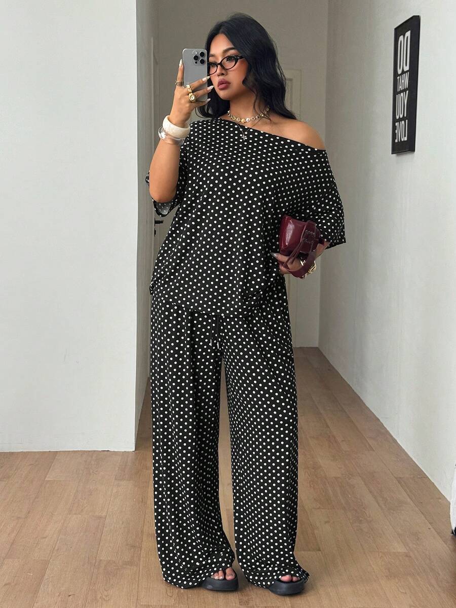 Women's two-piece lounge set featuring a loose drop shoulder asymmetrical neck short sleeve t-shirt and wide-leg knit pants with pockets.