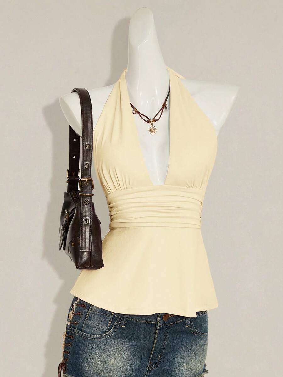 Women's backless halter babydoll tank top featuring a square neckline, slim fit silhouette, and a flared ruffle hem.