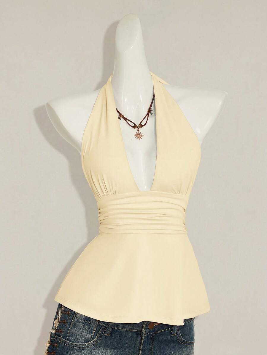 Women's backless halter babydoll tank top featuring a square neckline, slim fit silhouette, and a flared ruffle hem.