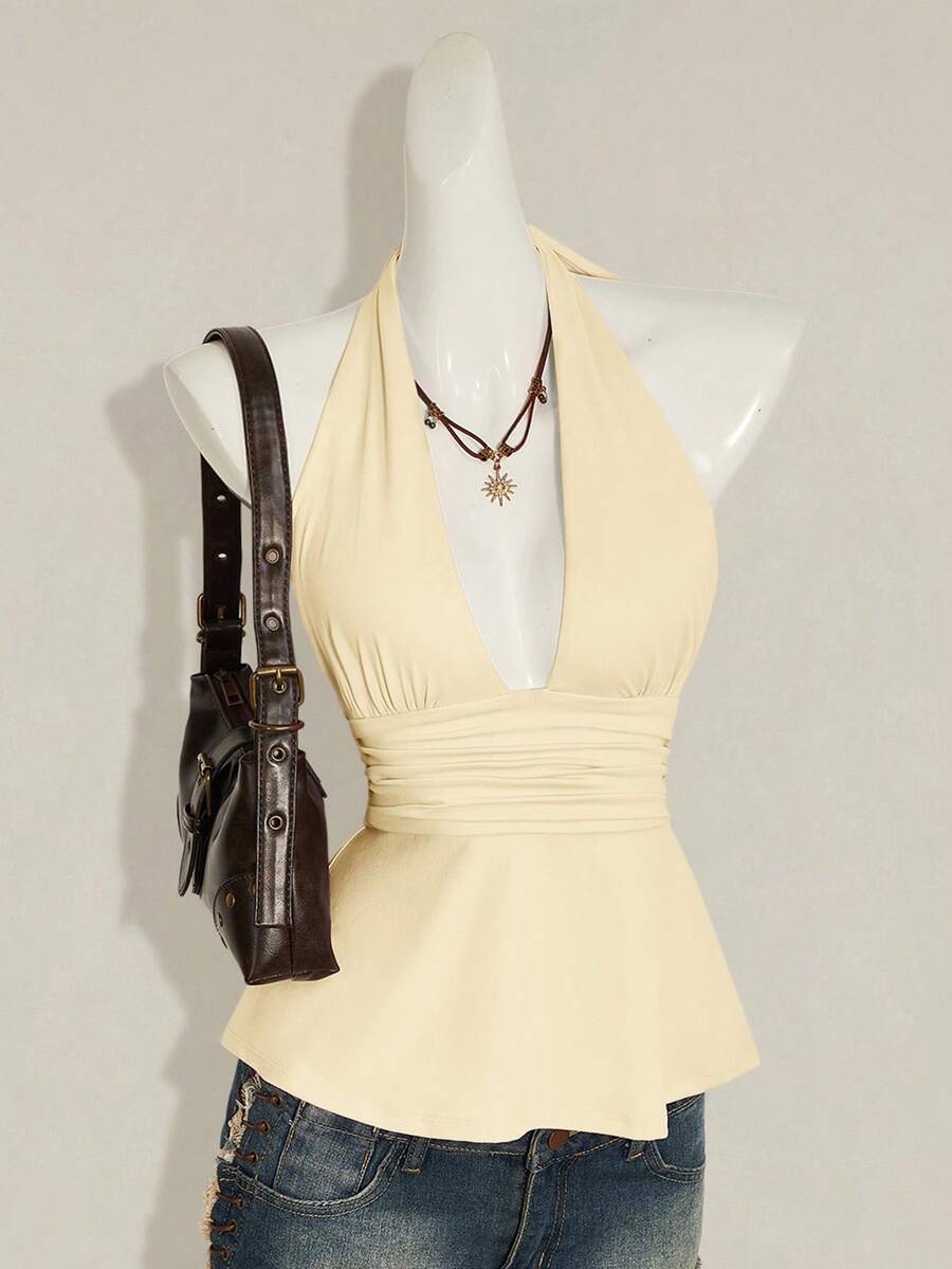 Women's backless halter babydoll tank top featuring a square neckline, slim fit silhouette, and a flared ruffle hem.