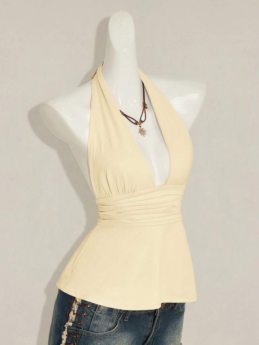 Women's backless halter babydoll tank top featuring a square neckline, slim fit silhouette, and a flared ruffle hem.