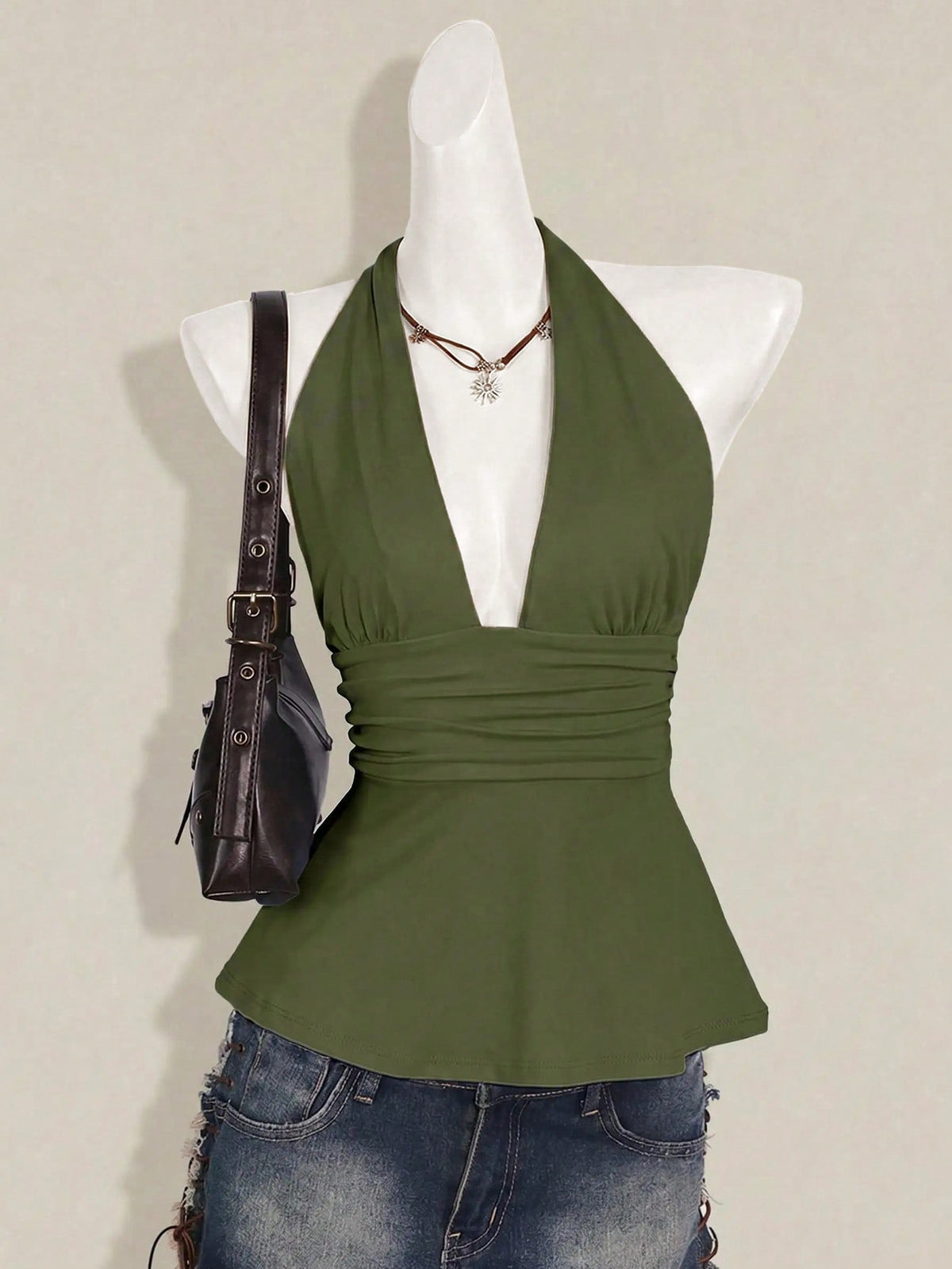 Women's backless halter babydoll tank top featuring a square neckline, slim fit silhouette, and a flared ruffle hem.