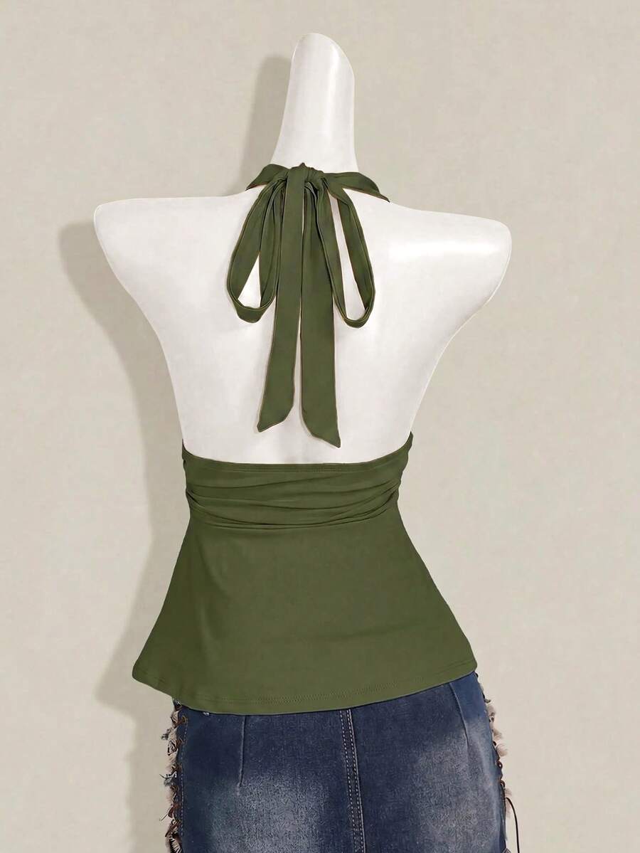 Women's backless halter babydoll tank top featuring a square neckline, slim fit silhouette, and a flared ruffle hem.