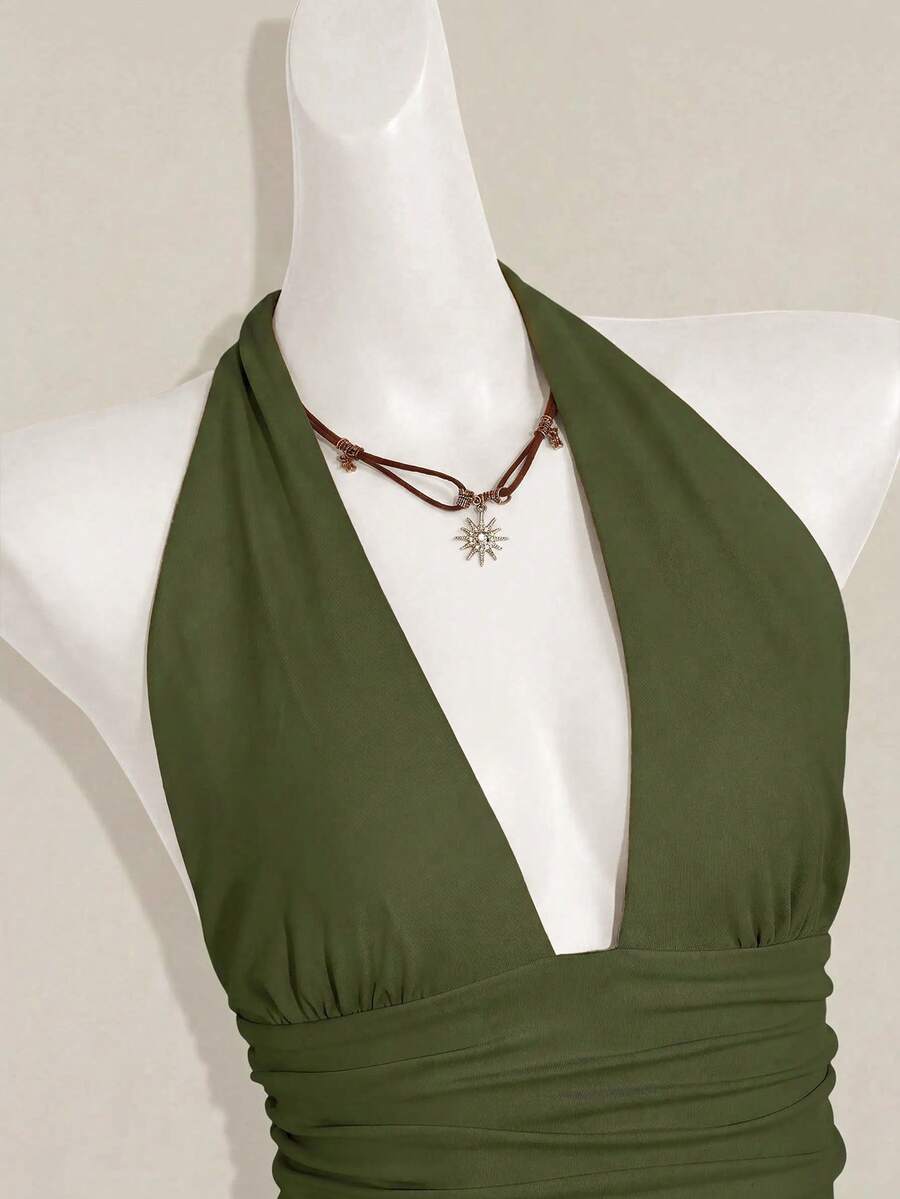 Women's backless halter babydoll tank top featuring a square neckline, slim fit silhouette, and a flared ruffle hem.