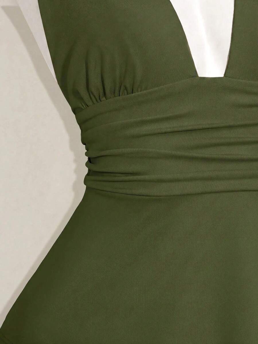Women's backless halter babydoll tank top featuring a square neckline, slim fit silhouette, and a flared ruffle hem.