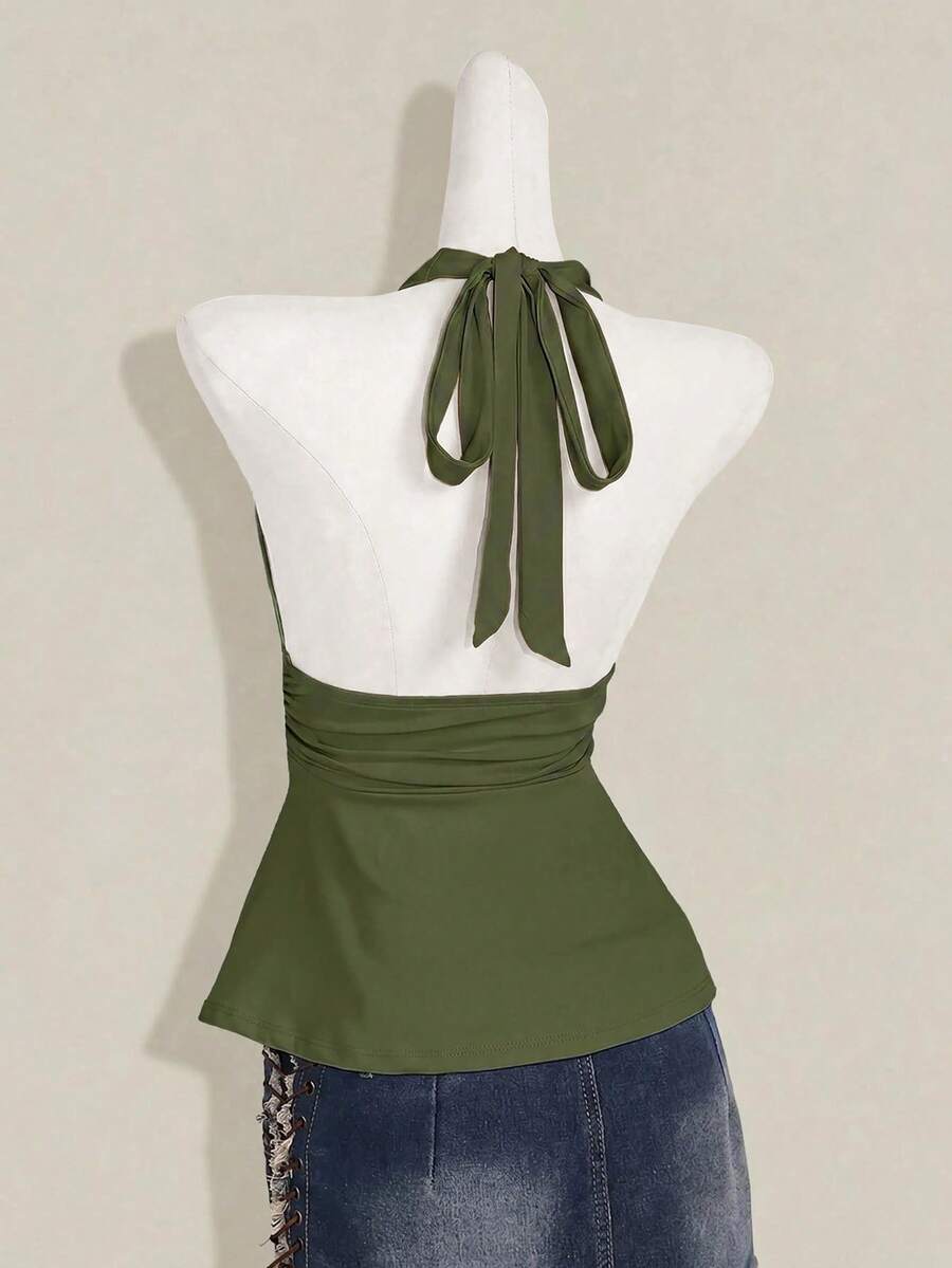 Women's backless halter babydoll tank top featuring a square neckline, slim fit silhouette, and a flared ruffle hem.