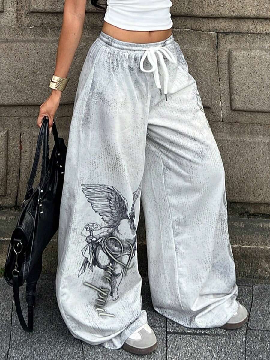 Women's loose fit wide leg graphic sweatpants in light grey with an elastic drawstring waistband