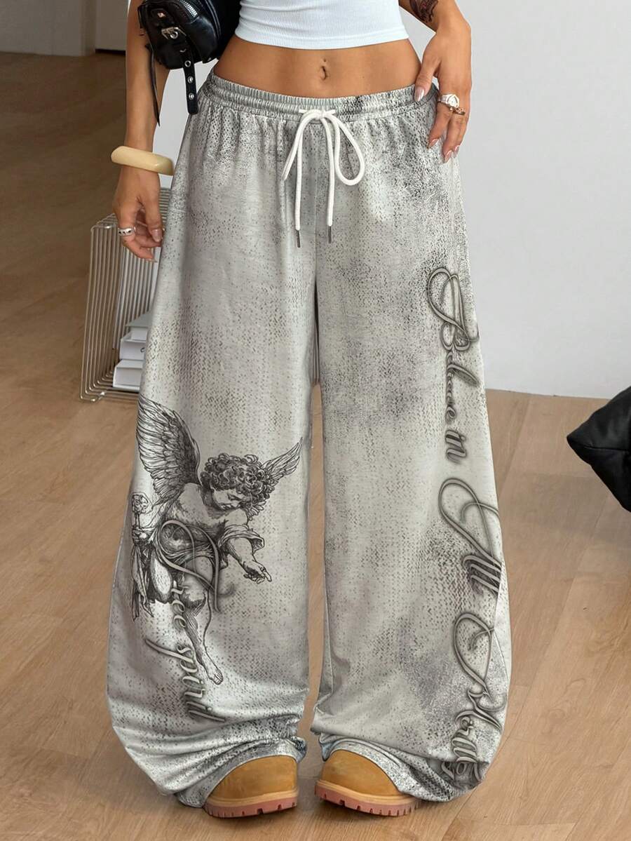 Women's loose fit wide leg graphic sweatpants in light grey with an elastic drawstring waistband