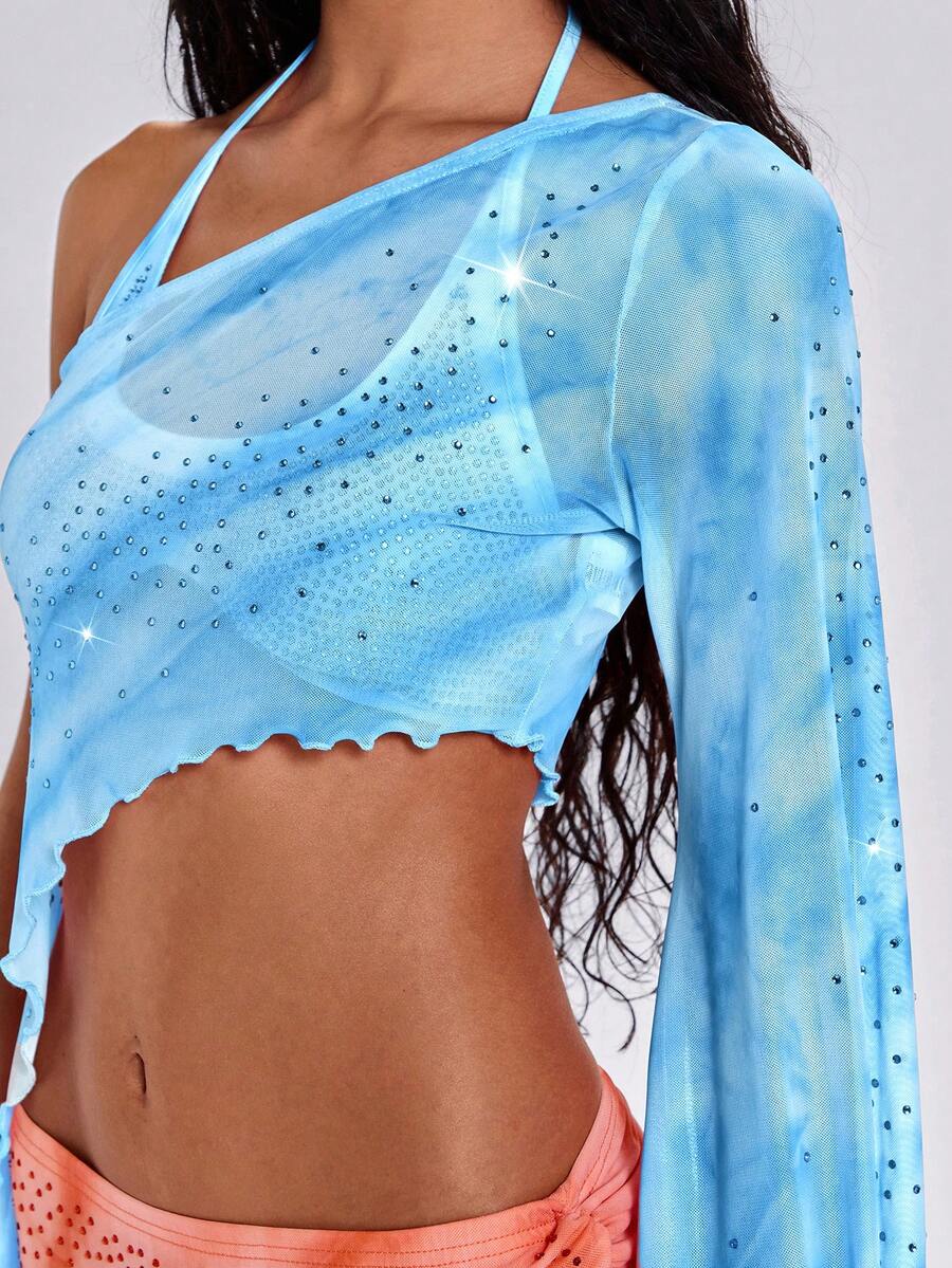Women's one shoulder crop top featuring an asymmetrical long sleeve, colorful print, and sparkling rhinestone embellishments.