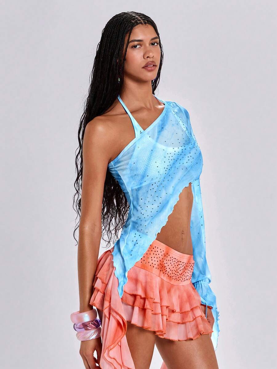 Women's one shoulder crop top featuring an asymmetrical long sleeve, colorful print, and sparkling rhinestone embellishments.
