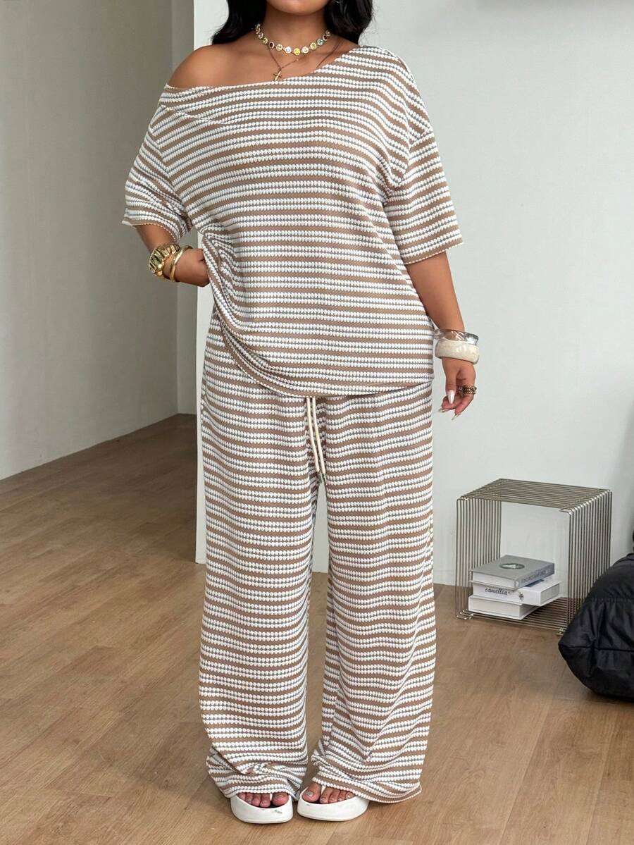 Women's two-piece lounge set featuring a loose drop shoulder asymmetrical neck short sleeve t-shirt and wide-leg knit pants with pockets.