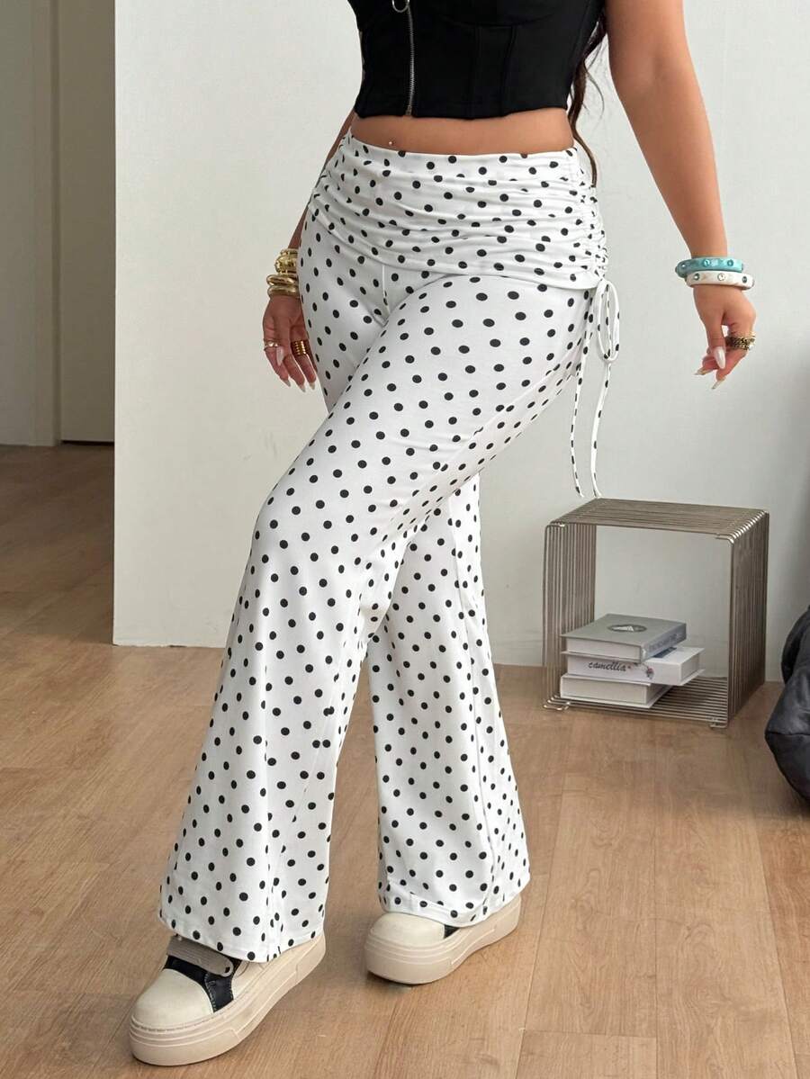 Women's striped flare leg pants featuring a mid-rise waist, slim fit thigh, and ruched side drawstring detail in stretch knit fabric.