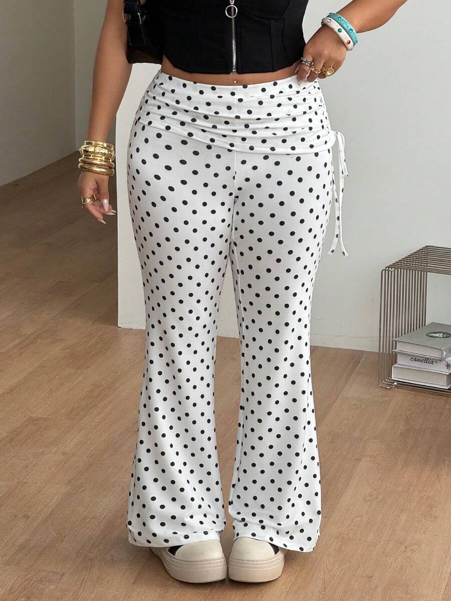 Women's striped flare leg pants featuring a mid-rise waist, slim fit thigh, and ruched side drawstring detail in stretch knit fabric.