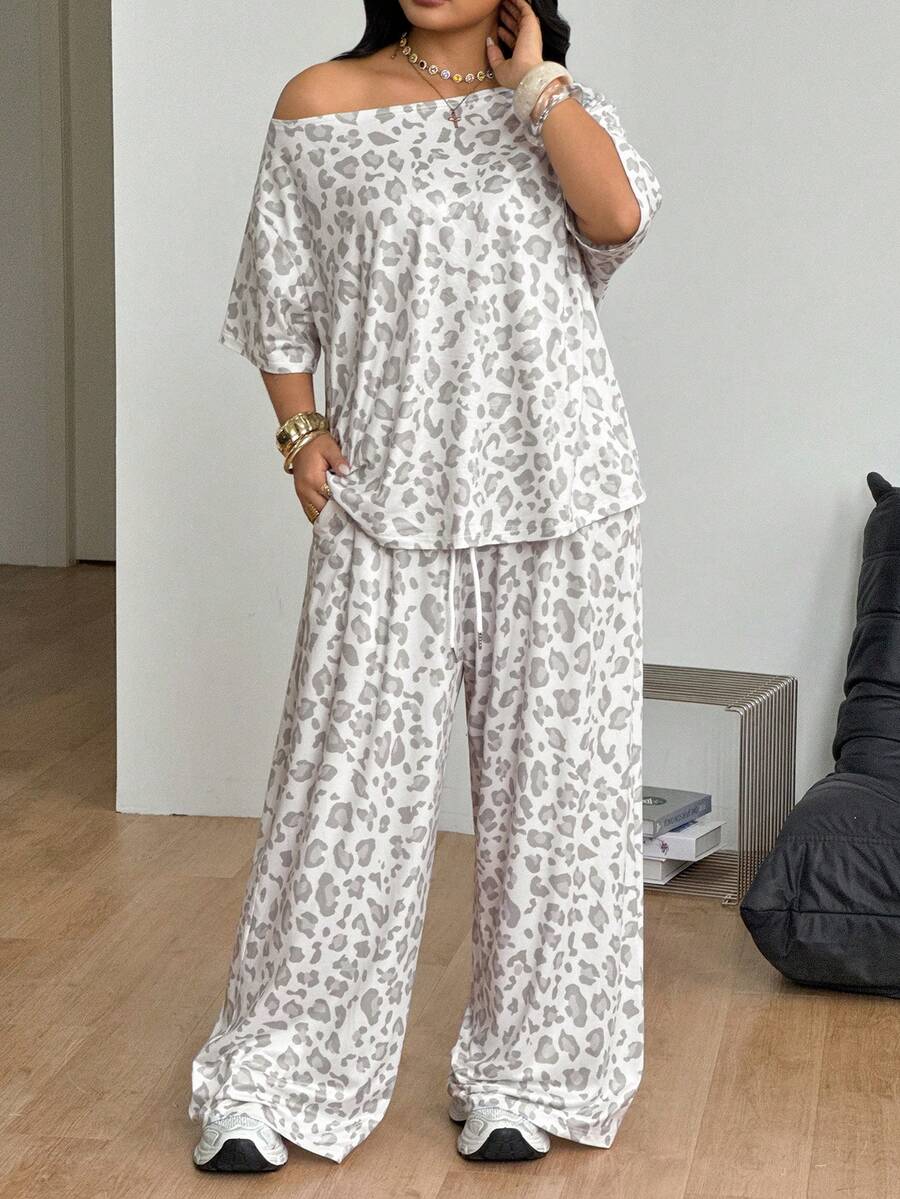 Women's two-piece lounge set featuring a loose drop shoulder asymmetrical neck short sleeve t-shirt and wide-leg knit pants with pockets.