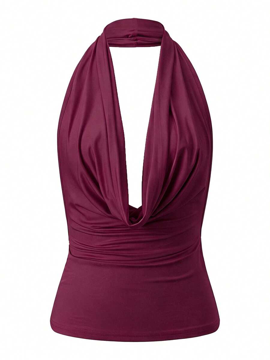 Women's backless halter crop top featuring a draped cowl front, knot detail, and slim fit design.