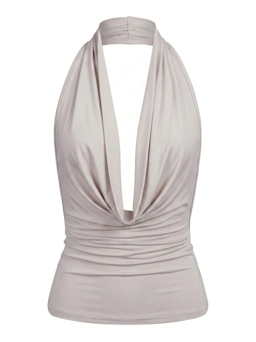 Women's backless halter crop top featuring a draped cowl front, knot detail, and slim fit design.