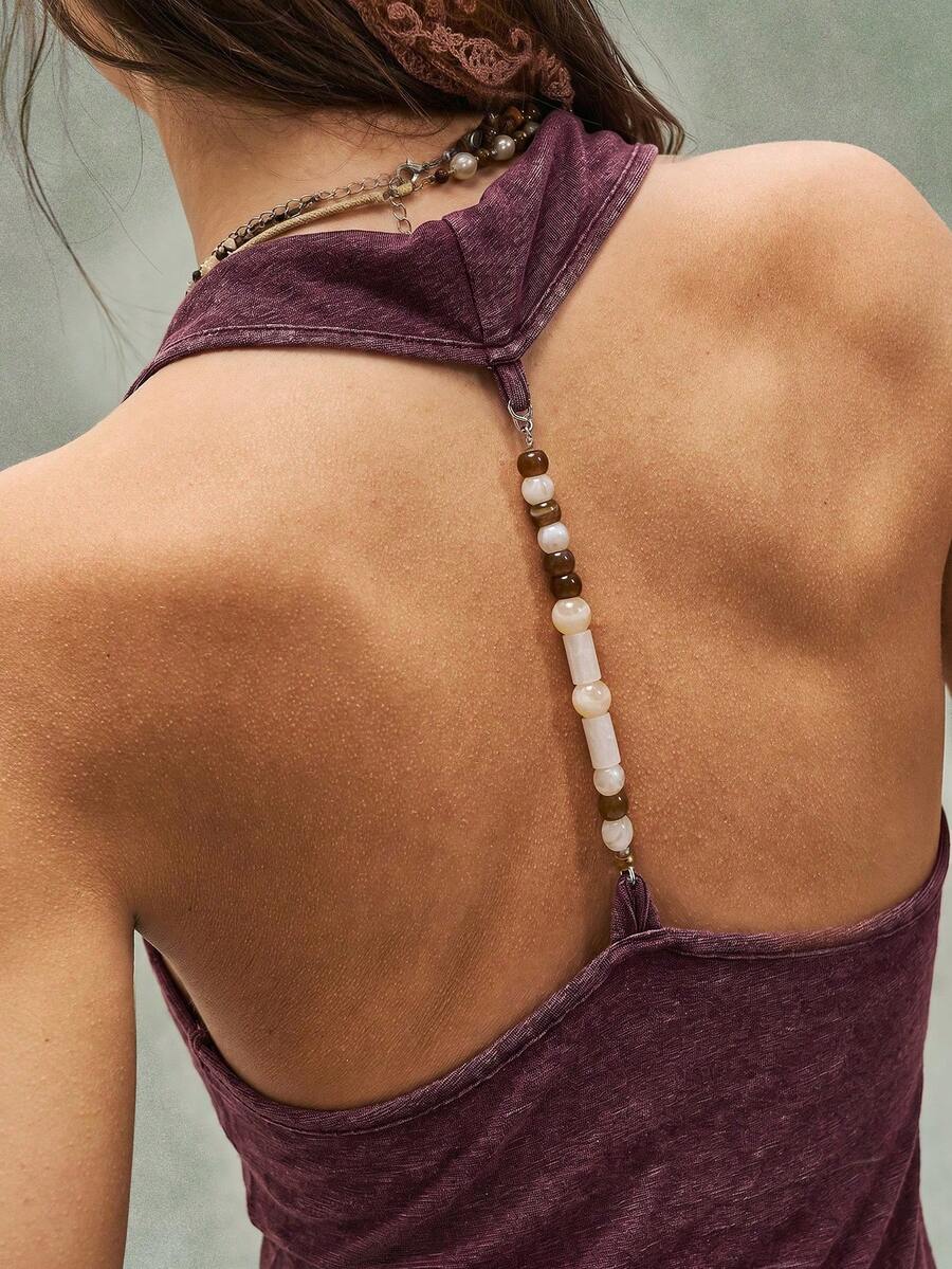 Women's casual solid color knit tank top with a backless halter neck design.