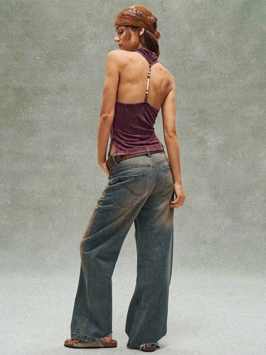 Women's casual solid color knit tank top with a backless halter neck design.