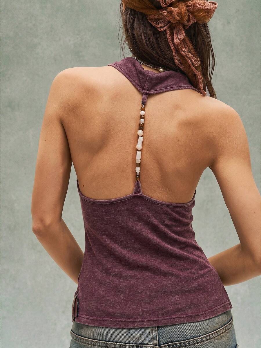 Women's casual solid color knit tank top with a backless halter neck design.