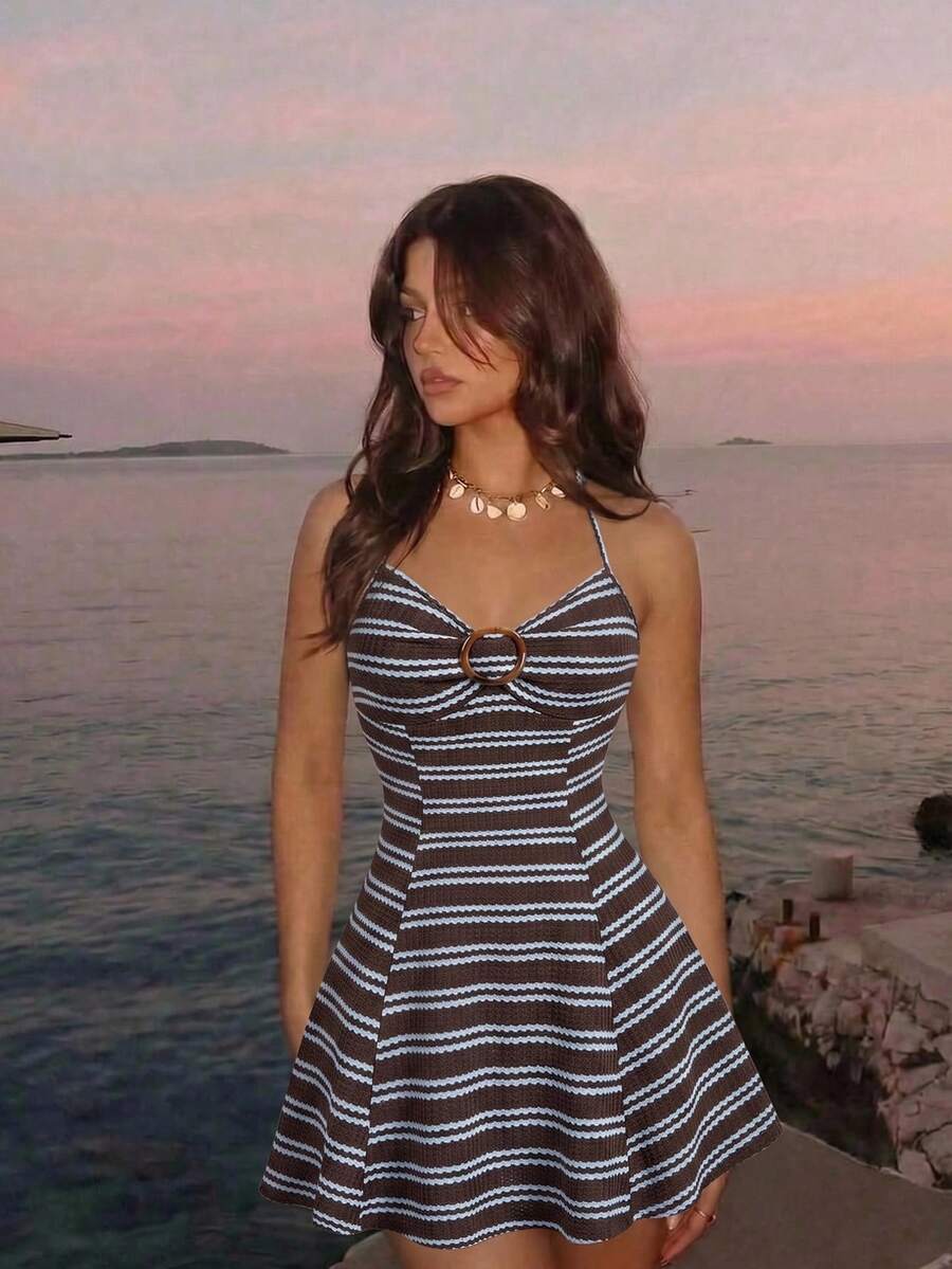 Women's apricot halter mini dress with backless knot and ring detail, sleeveless cami style, flared hem, and boho vacation look