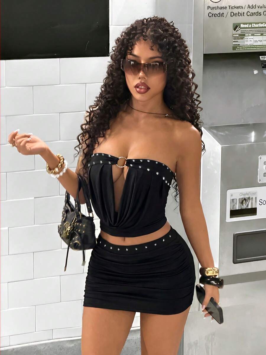 Women's Y2K two-piece set with a strapless bandeau crop top and matching studded mini skirt in a slim fit.