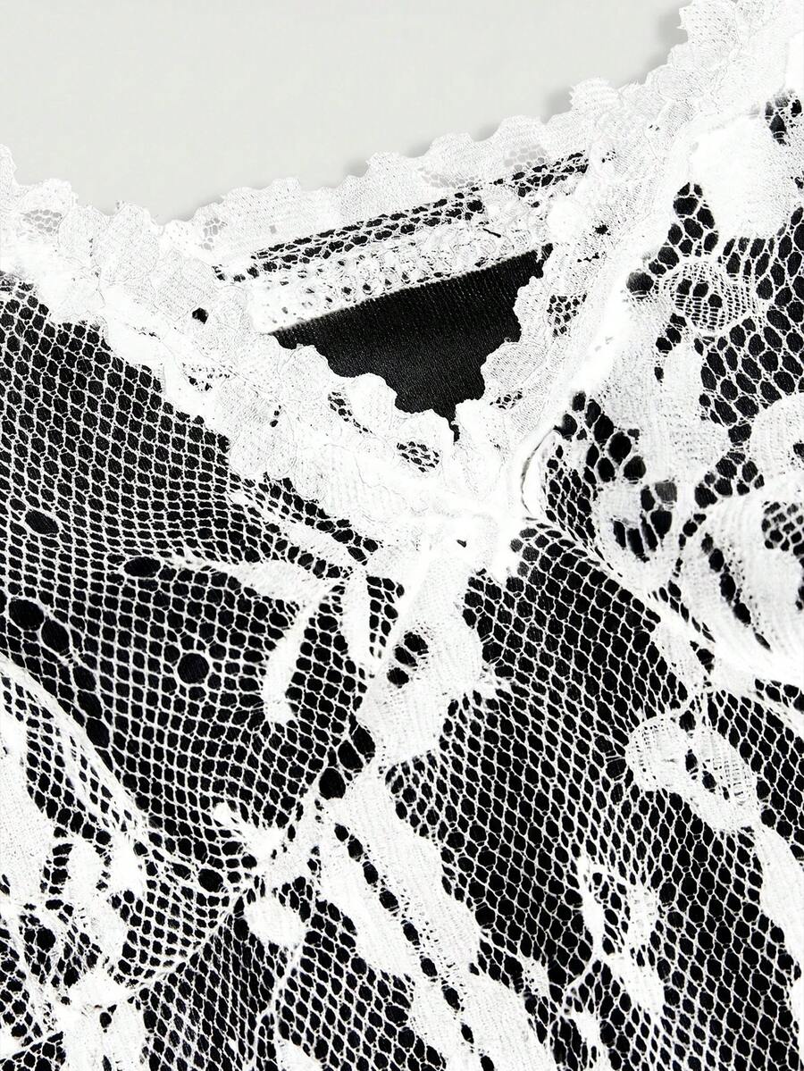 Women's short lace cami dress with spaghetti straps, contrast lace detailing, high waist, slim fit, and straight hem.