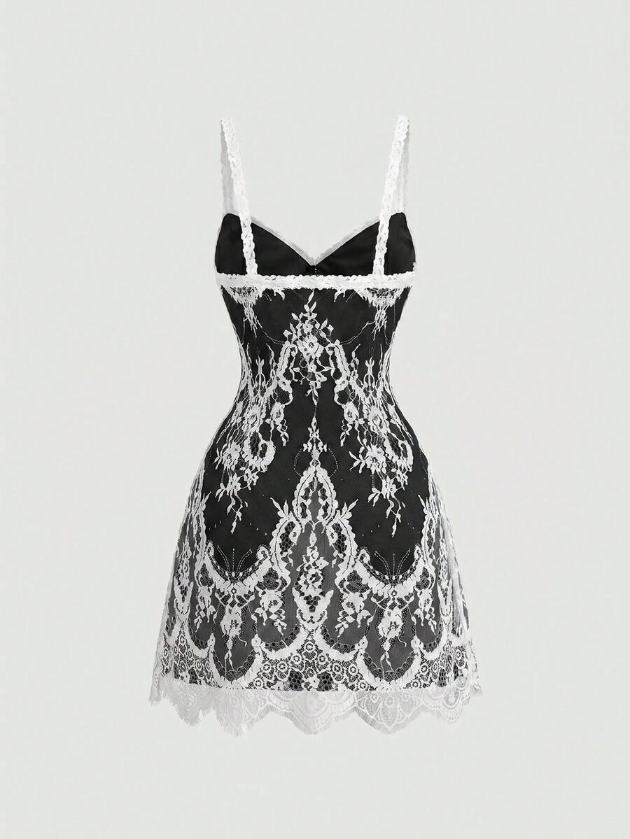 Women's short lace cami dress with spaghetti straps, contrast lace detailing, high waist, slim fit, and straight hem.
