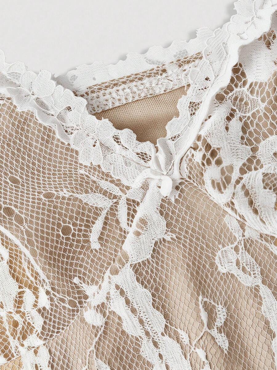 Women's short lace cami dress with spaghetti straps, contrast lace detailing, high waist, slim fit, and straight hem.